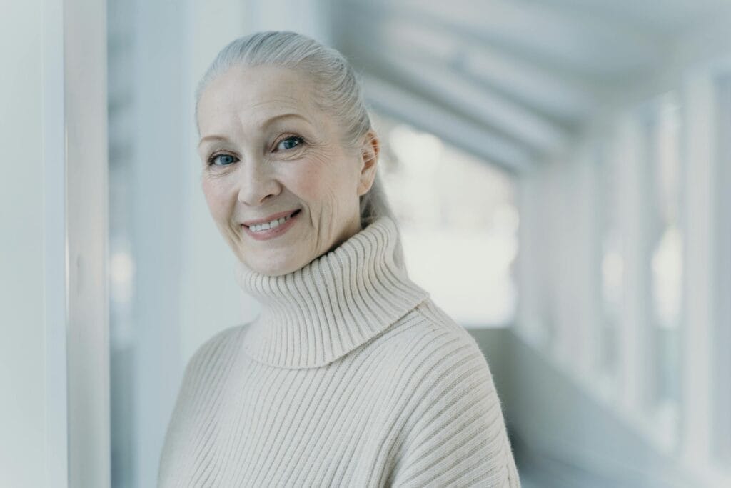 Smiling woman with dental bridge from Ivy Lane Dentistry